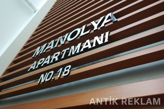 Manolya Apartmanı paslanmaz kutu harf tabela cephe görünümü